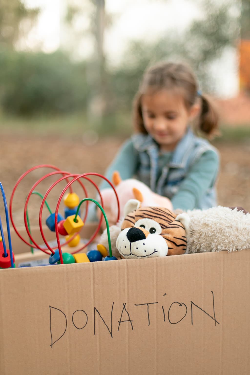 Happy child with a book at Priya Sarv Utthan learning center in Gandhi Nagar, Indore - Free education and mentorship for underprivileged children